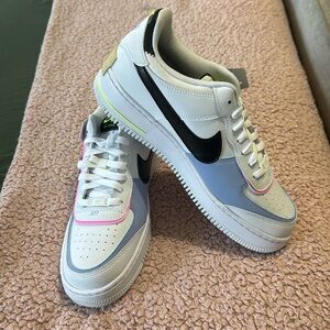 White Air Force ones with neon, pink and baby blue